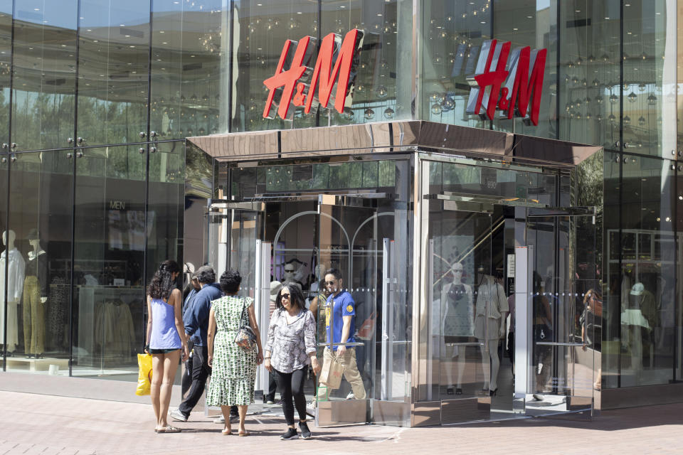 Shoppers enter and leave the H&M store 