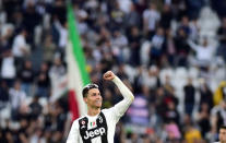 FILE PHOTO: Soccer Football - Serie A - Juventus v Fiorentina - Allianz Stadium, Turin, Italy - April 20, 2019 Juventus' Cristiano Ronaldo celebrates winning the league after the match REUTERS/Massimo Pinca