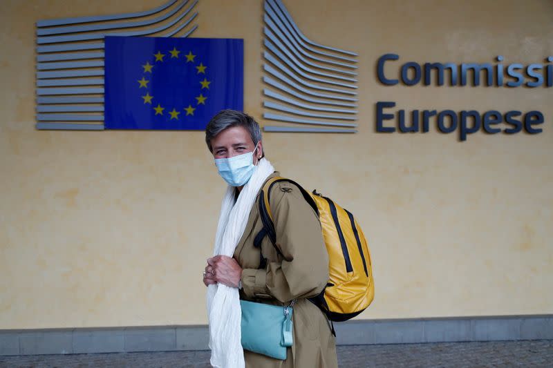 FILE PHOTO: European Competition Commissioner Margrethe Vestager wearing a protective mask leaves the EU Commission headquarters in Brussels