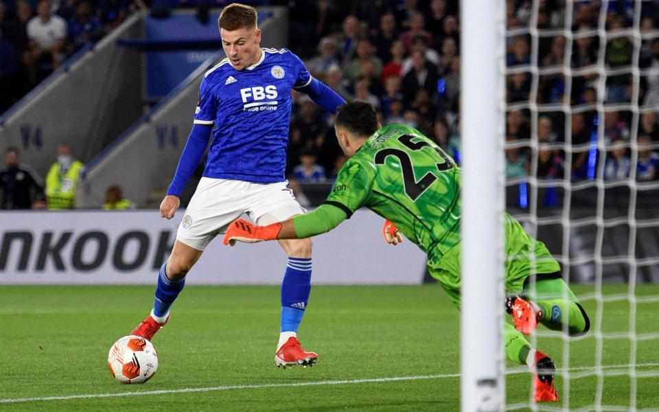 Napoli's Colombian goalkeeper David Ospina (R) dives to save a shot from Leicester City's English midfielder Harvey Barnes  - OLI SCARFF/AFP via Getty Images