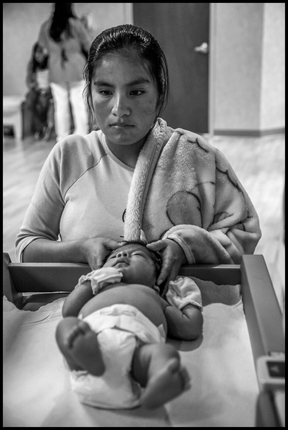 At the Las Islas Clinic in Oxnard pregnant women and mothers and children from Oaxaca and Guerrero receive health care in their native Mixtec language.  Pictured:  Rosalia Solana and baby Joel Galvez