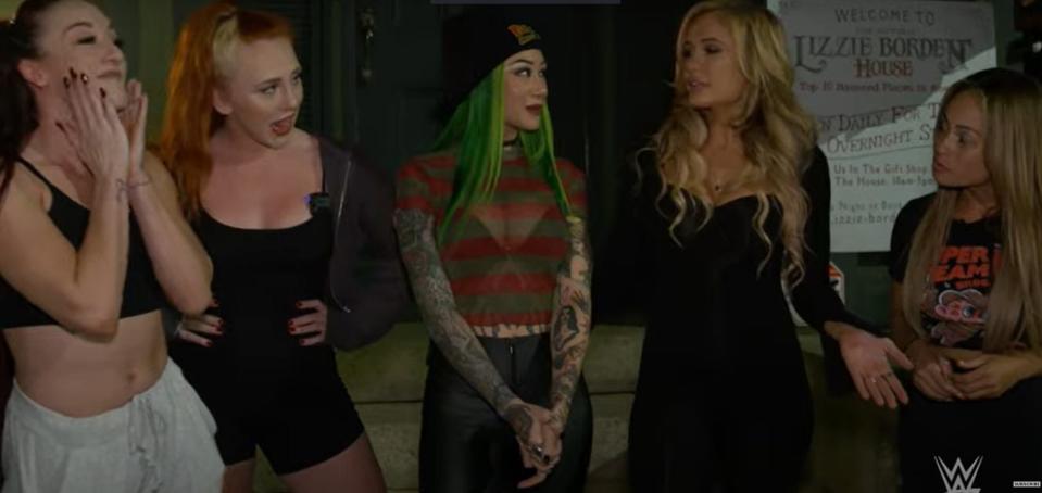 From left, WWE superstars Alba Fyre, Isla Dawn, Schotzi, Scarlett Bordeaux and Kayla Braxton stand outside the Lizzie Borden House in Fall River for their episode of WWE's "Chamber of Horrors" series.