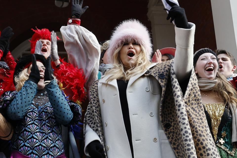 Harvard's Hasty Pudding Theatricals Woman of the Year Jennifer Coolidge, center, celebrates with Hasty Pudding members after a parade in her honor, Saturday, Feb. 4, 2023, in Cambridge, Mass. (AP Photo/Michael Dwyer)
