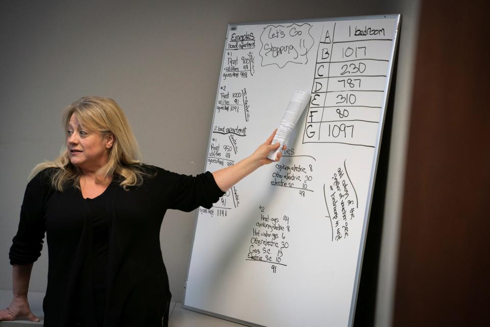 General manager Joy Pedersen, 52, leads a budgeting presentation for people hoping to secure stable housing at RPI Management, Inc. in Dearborn on Jan. 20, 2023.