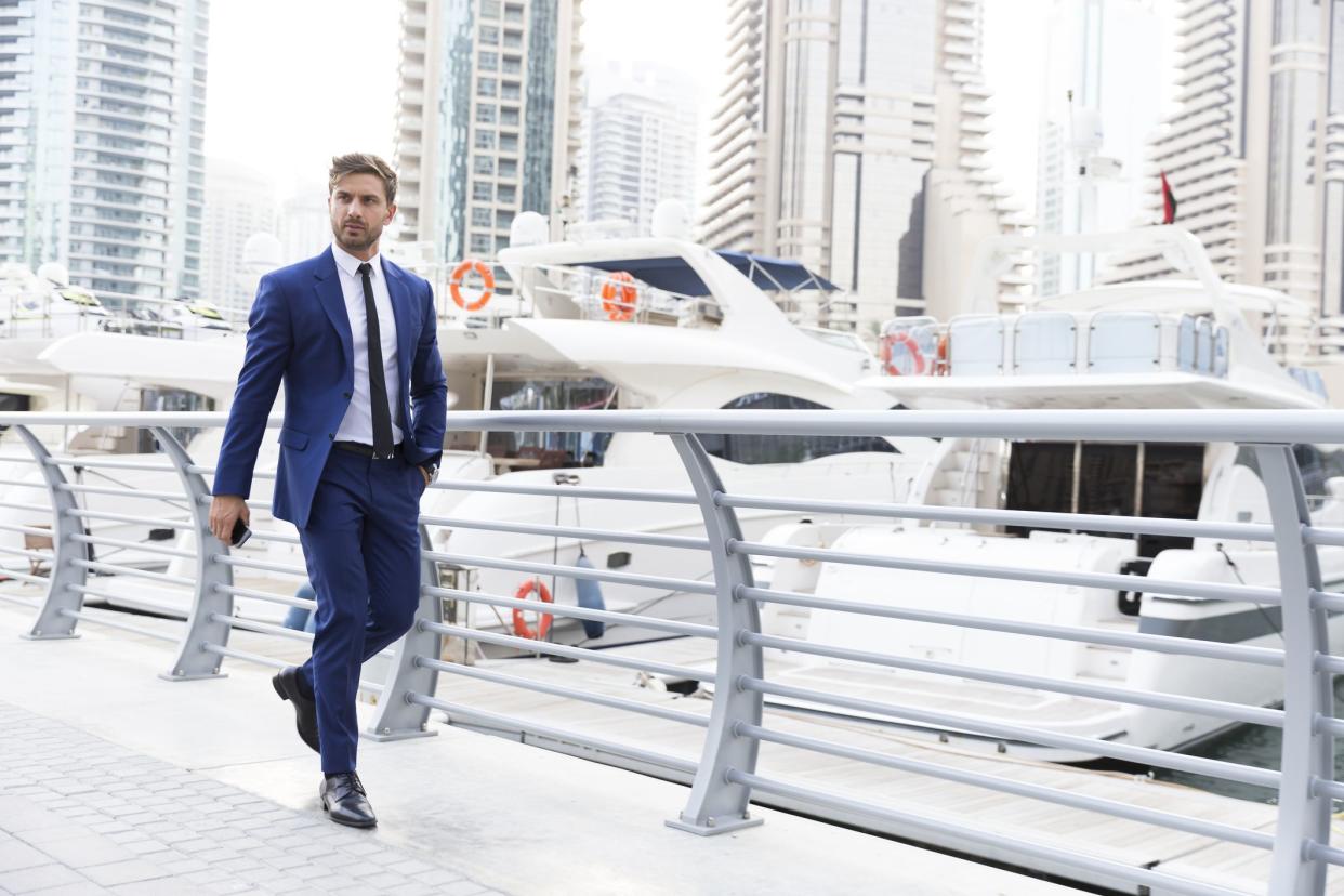 Business executive just off-boarded his boat and rushing to his office