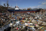 A cargo ship washed ashore is seen four days after super typhoon Haiyan hit Anibong town, Tacloban city, central Philippines November 11, 2013.