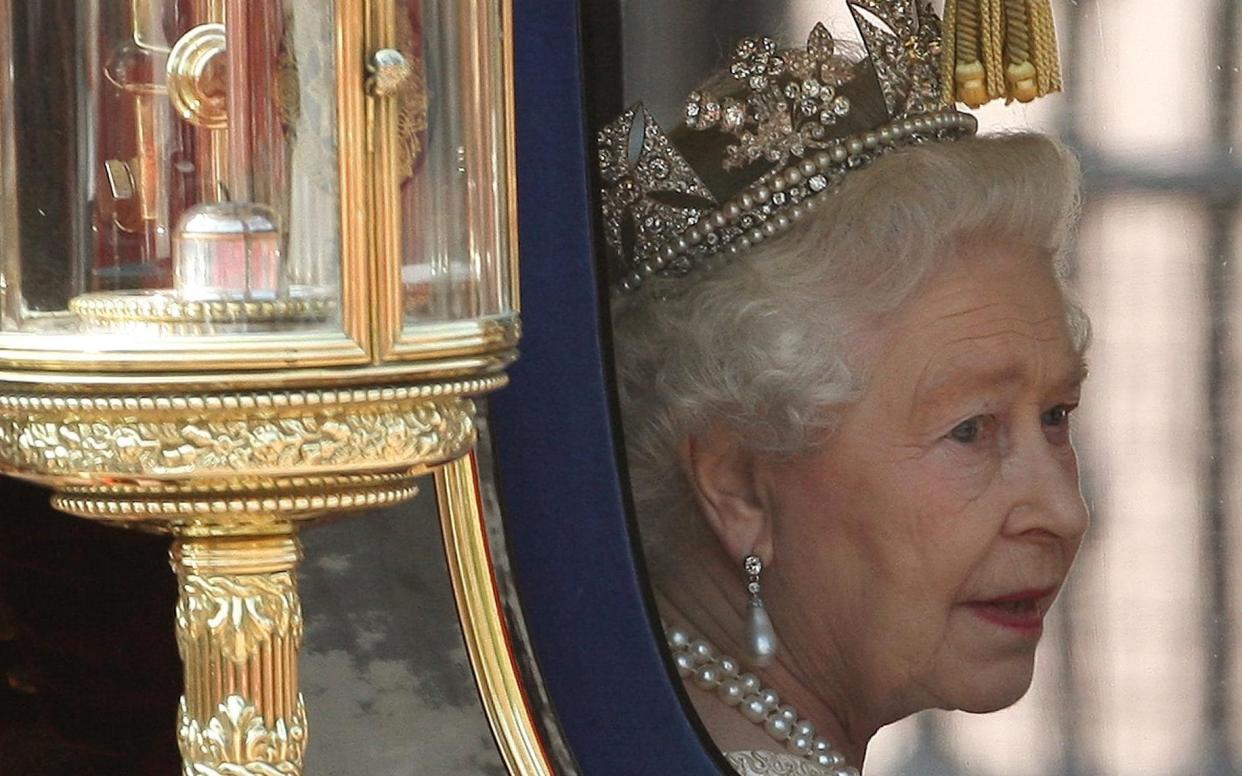 The Queen returns to Buckingham Palace after the State Opening of Parliament in 2010. She has been fulfilling the duties of Head of Nation and Head of State for 70 years - PA