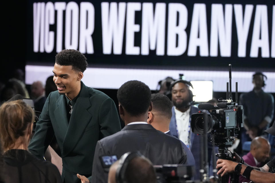 Victor Wembanyama reacts after being selected first overall by the San Antonio Spurs during the NBA basketball draft, Thursday, June 22, 2023, in New York. (AP Photo/John Minchillo)