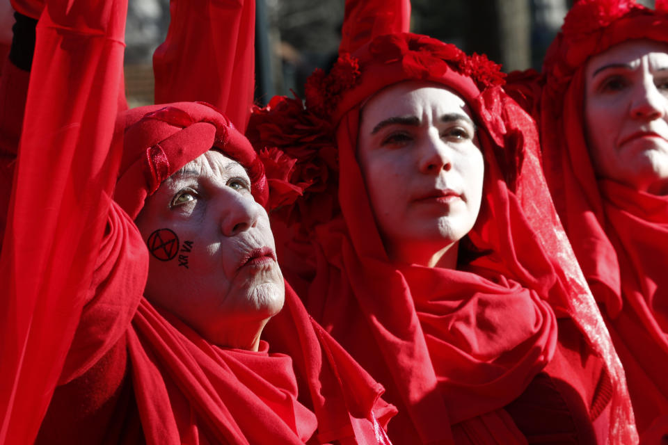 Extinction Rebellion climate protesters demonstrate outside the Virginia State Capitol in Richmond, Va., Wednesday, Jan. 8, 2020. The 2020 session of the Virginia General Assembly begins Wednesday. (AP Photo/Steve Helber)