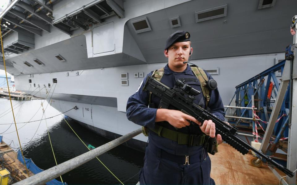 Bosuns mate Scott Campbell,onboard the HMS Queen Elizabeth Aircraft Carrier  - Credit: Jeff J Mitchell/Getty