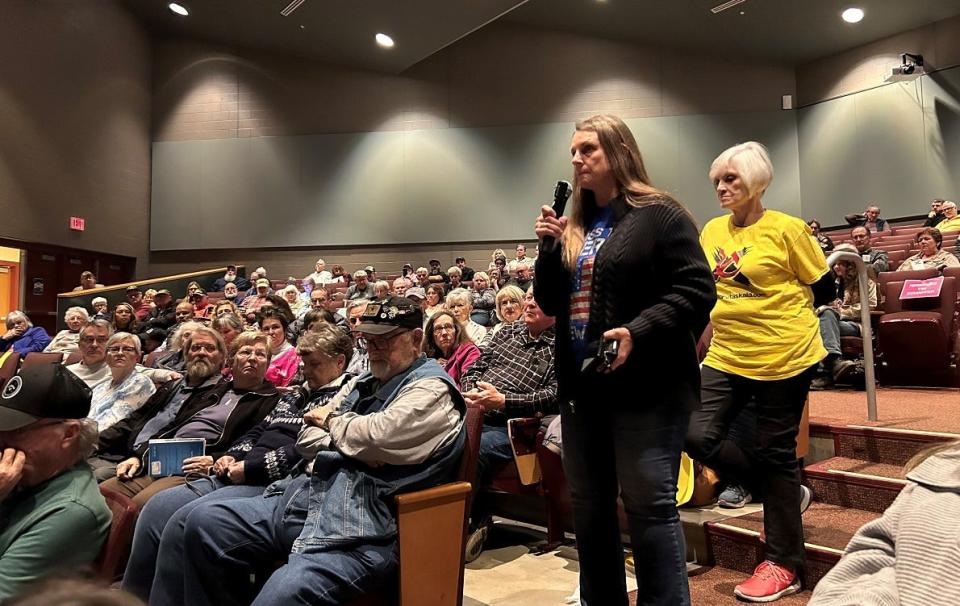 A woman, who did not share her name, speaks Tuesday during the Not In Our Town Townhall at Licking Heights Middle School, which drew roughly 200 people.