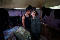 <p>Yeimi and Sebastian, members of the 51st Front of the Revolutionary Armed Forces of Colombia (FARC), are seen inside a tent at a camp in Cordillera Oriental, Colombia, August 16, 2016. (John Vizcaino/Reuters) </p>