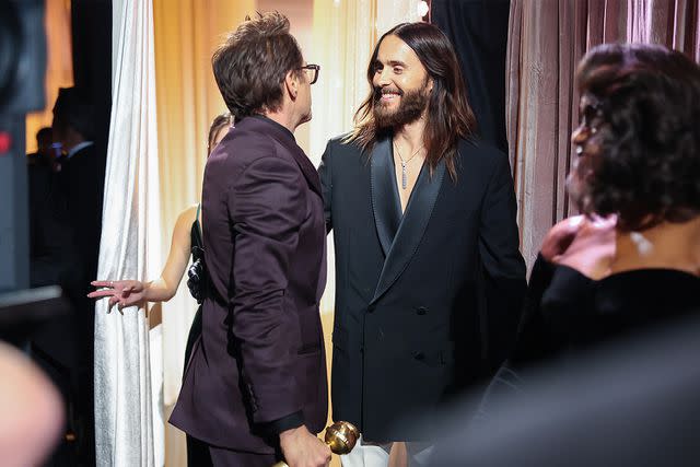 <p>Christopher Polk/Golden Globes 2024/Golden Globes 2024 via Getty </p> Robert Downey Jr. and Jared Leto