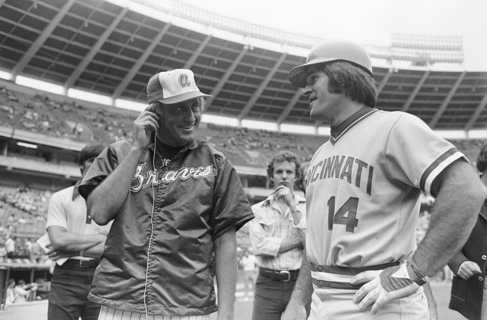 FILE - Cincinnati Reds' Pete Rose, right, who will attempt a hit in his 44th straight game, is interviewed by Atlanta Braves pitcher Phil Niekro for a television sportscast prior to a game in Atlanta, in this July 31, 1978, file photo. Pete Rose says “You wanna know the truth? I faced 19 Hall of Fame pitchers in the 1970s and 1980s. I don’t know if guys today are facing 19 Hall of Fame pitchers.” (AP Photo/Charles Kelly, File)