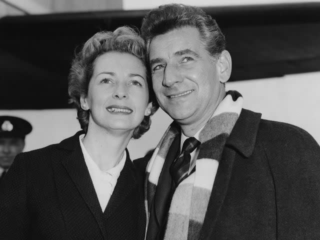 <p>Lee/Central Press/Hulton Archive/Getty</p> Leonard Bernstein at London Airport with his wife, actress Felicia Montealegre on October 9, 1959.
