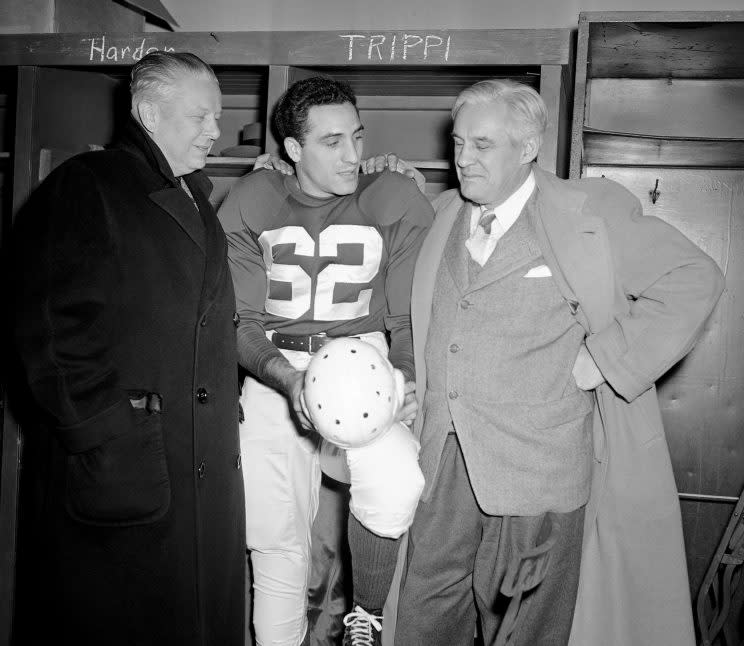 From left, owner Charles Bidwell of Chicago Cardinals; Charles Trippi and coach Jim Conzelman after Trippi signed in 1947 (AP)