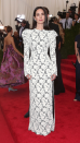 <p> There was no missing Connelly at the Met Gala in New York in 2015. The star stunned in a lacy white gown by Louis Vuitton, which featured long puff sleeves and a subtle side thigh-split. She finished off the elegant look with her signature black hair worn straight, and glowy makeup. </p>