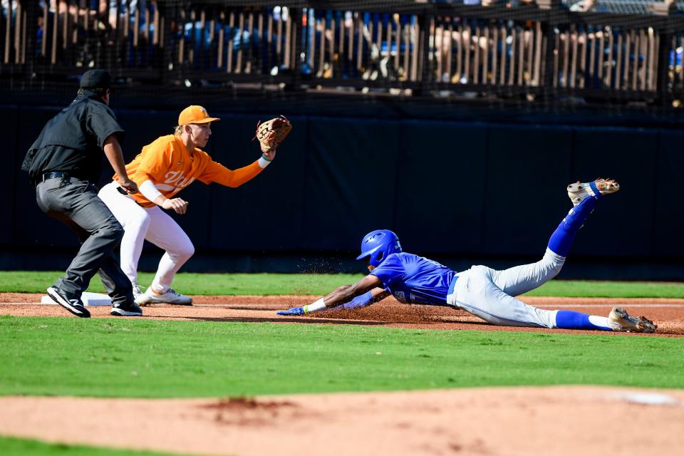 Tennessee’s Zane Denton attempts to get Memphis’ Cameron Benson (17) out as he slides for third base during the game between University of Memphis and Tennessee on Sunday, November 6, 2022, at The Ballpark at Jackson in Jackson, Tenn. The teams played an 18-inning game as the last official game of the fall season. Tennessee outscored Memphis 22-4. 