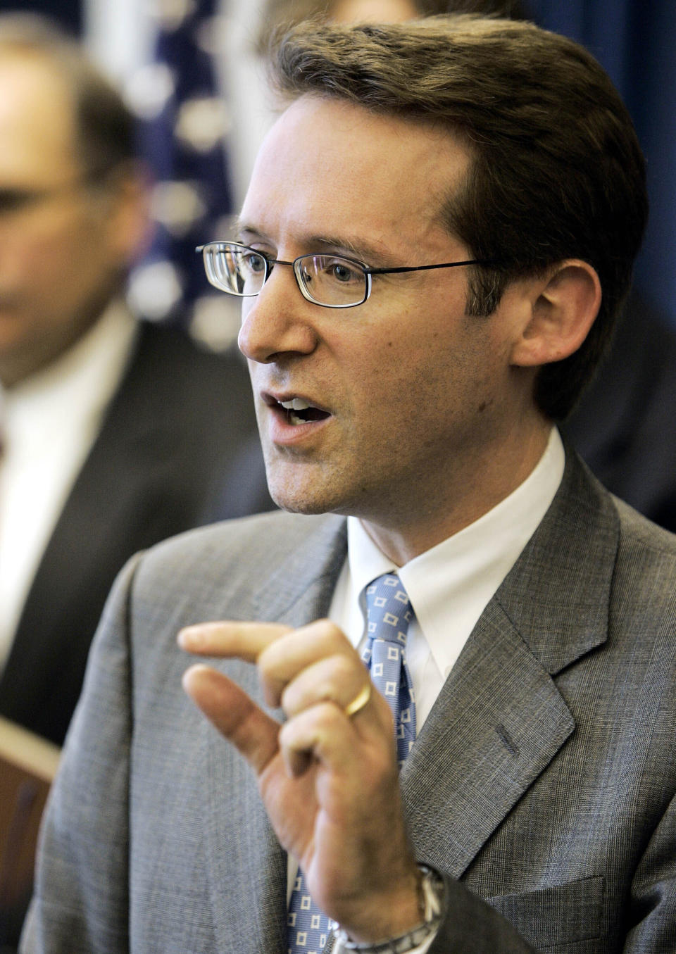 FILE - David Uhlmann, chief of the environmental crimes section of the U.S. Department of Justice, answers questions during a news conference regarding Davis-Besse plant Jan. 20, 2006, in Cleveland. The Environmental Protection Agency conducted more on-site inspections of polluting industrial sites this year than any time since the start of the COVID-19 pandemic, the agency said Monday, Dec. 18, 2023, as it seeks to reinvigorate its enforcement program after more than a decade of budget cuts. Uhlmann was confirmed as the EPA's assistant administrator for enforcement in July. (AP Photo/Tony Dejak, File)