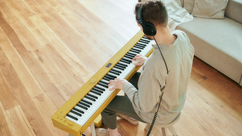 Playing Casio's Privia PX-S7000 electronic keyboard presented in Harmonious Mustard.