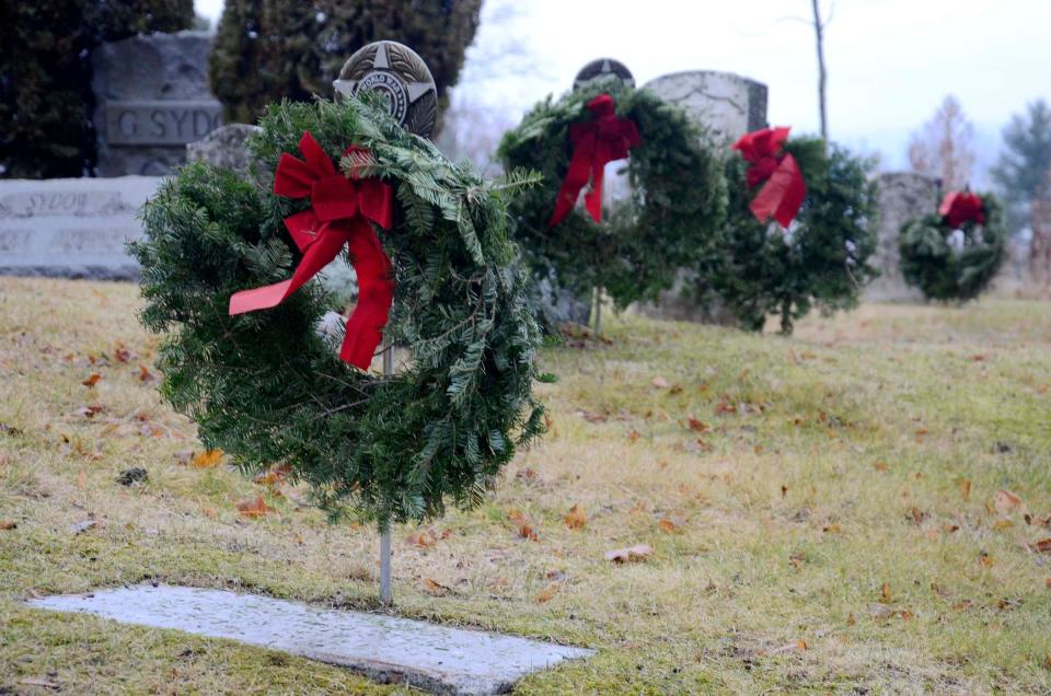 More than 1,000 wreaths were placed at veterans' graves throughout Greenwood Cemetery in Petoskey on Saturday, Dec. 16, 2023 as part of the annual Wreaths Across America event.