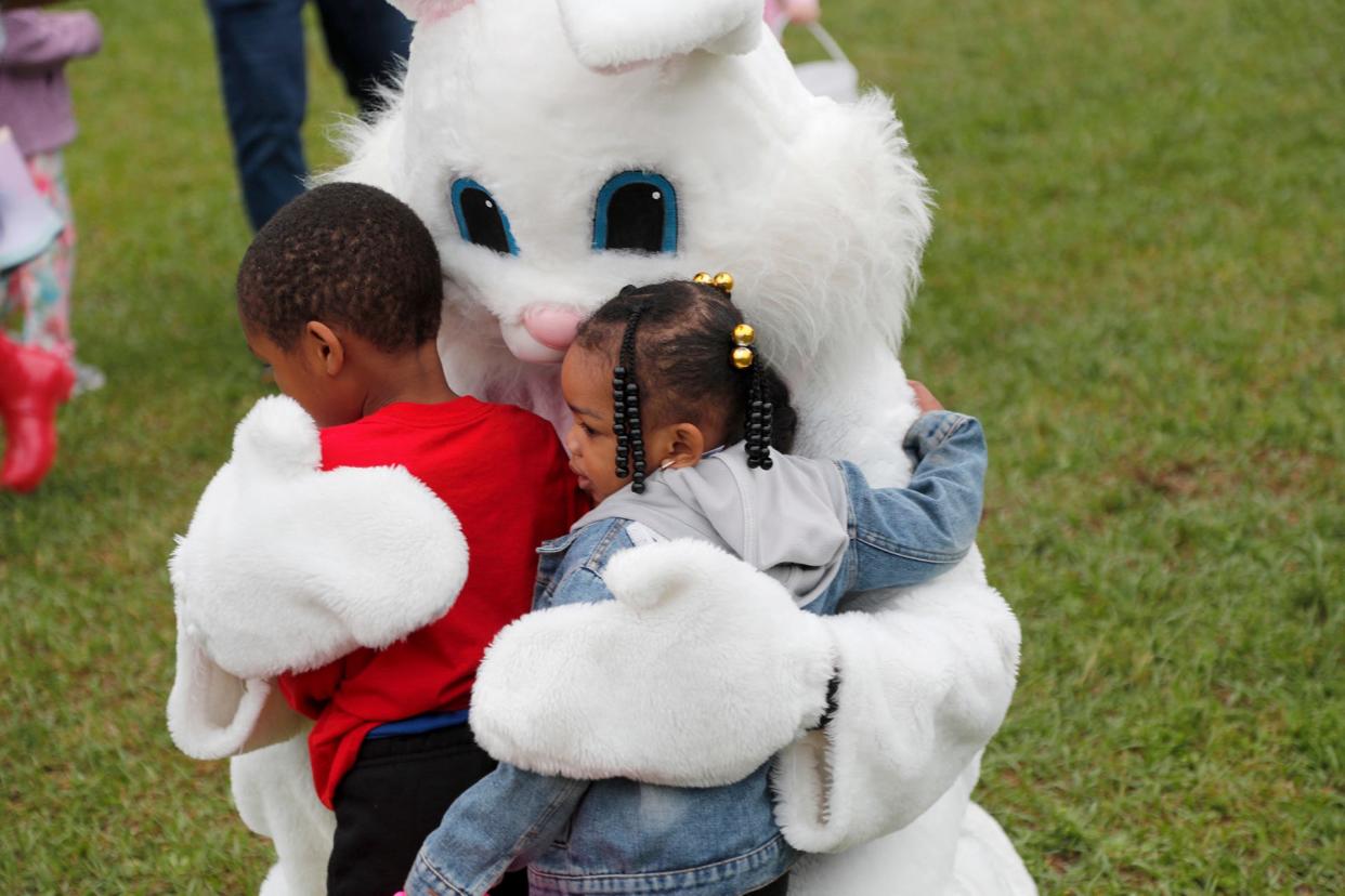 The Easter Bunny gets big hugs from children during the Great Thunderbolt EGG Hunt at Cesaroni Park in Thunderbolt.