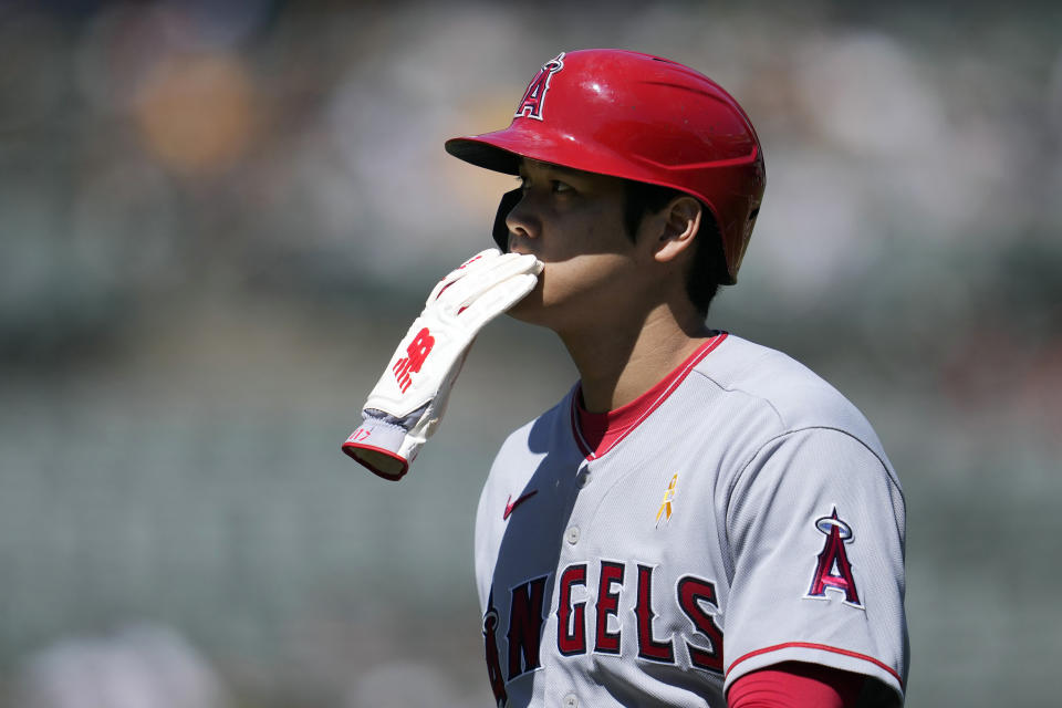 FILE - Los Angeles Angels' Shohei Ohtani walks to the dugout after being left on first base during the first inning of a baseball game against the Oakland Athletics in Oakland, Calif., Sunday, Sept. 3, 2023. Ohtani will miss the rest of the season because of an oblique injury, the team announced, Saturday, Sept. 16, 2023. (AP Photo/Jeff Chiu, File)