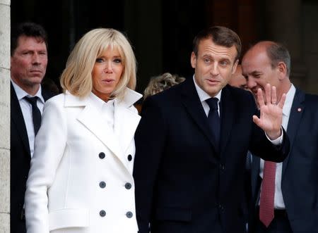 French President Emmanuel Macron and his wife Brigitte leave after casting their ballots during the European Parliament Elections, in Le Touquet, France, May 26, 2019. REUTERS/Philippe Wojazer