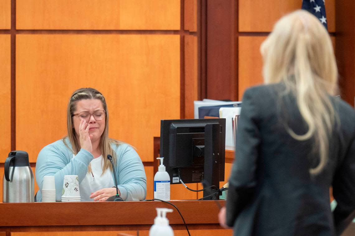 Leah Heiberg, a dispatcher with South Sound 911, tears up while she is cross-examined by Pierce County Sheriff Ed Troyer’s defense attorney Anne Bremner on Monday, Dec. 5, 2022, in Pierce County District Court in Tacoma.