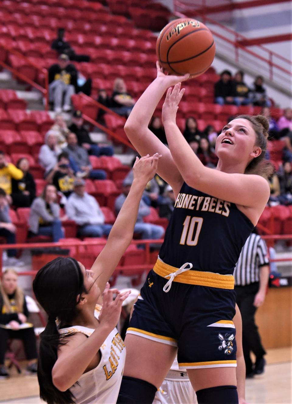 Stephenville's Chandler Glasgow (10) drives to the basket as a Snyder player defends in the first half.