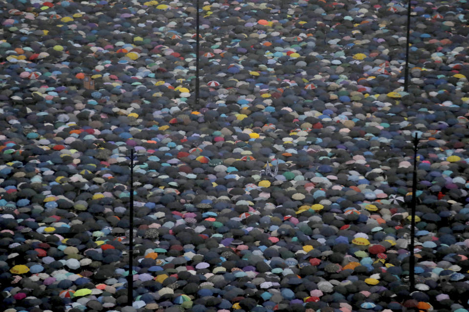 Protesters gather on Victoria Park in Hong Kong Sunday, Aug. 18, 2019. Thousands of people streamed into the park for what organizers hope will be a peaceful demonstration for democracy in the semi-autonomous Chinese territory. (AP Photo/Kin Cheung)