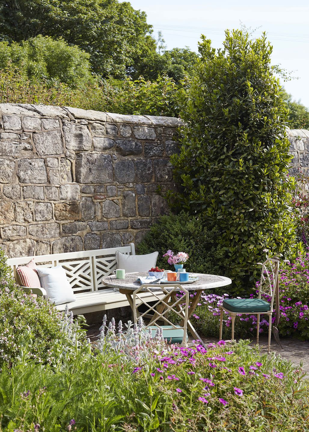 in the walled garden vintage brighton cafe chairs and a chinoiserie bench