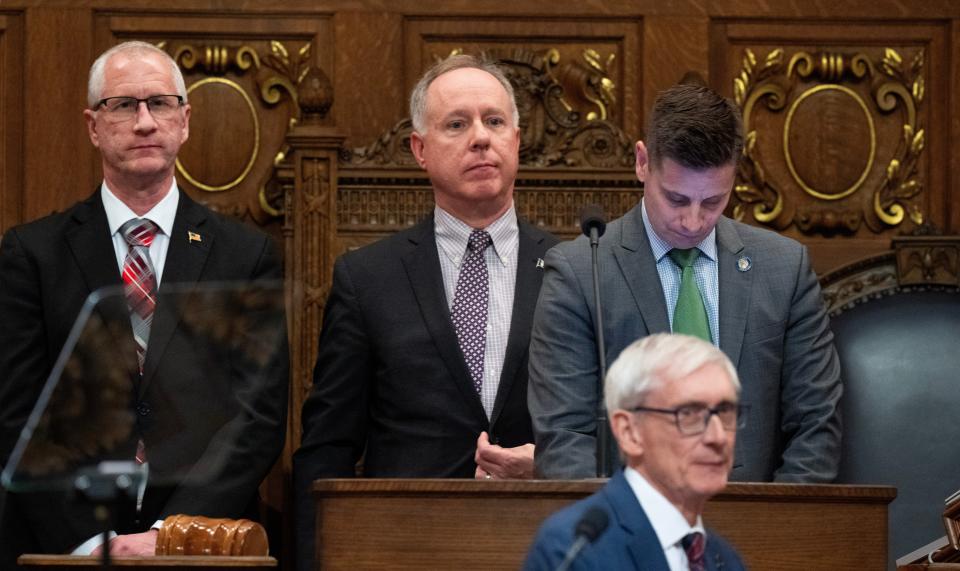 Speaker Pro Tempore Kevin Peterson, left, Assembly Speaker Robin Vos and Senate President Chris Kapenga stand as Gov. Tony Evers arrives to deliver his State of State address Tuesday, January 23, 2024 at the Capitol in Madison, Wisconsin.