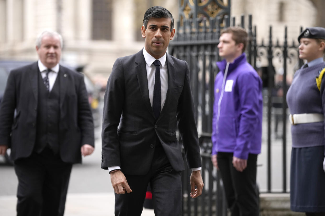 FILE - Britain's Chancellor Rishi Sunak arrives to attend a Service of Thanksgiving for the life of Prince Philip, Duke of Edinburgh at Westminster Abbey in London, Tuesday, March 29, 2022. Britain has unveiled plans to regulate some stablecoins as part of a broader plan to become a global hub for digital payments, as authorities in the U.S. and Europe race to draw up rules for cryptocurrencies. The British Treasury said Monday, April 4, 2022, that it would also work with the Royal Mint to create a digital collectible known as an NFT and introduce a set of measures aimed at attracting cryptocurrency companies. (AP Photo/Matt Dunham, File)