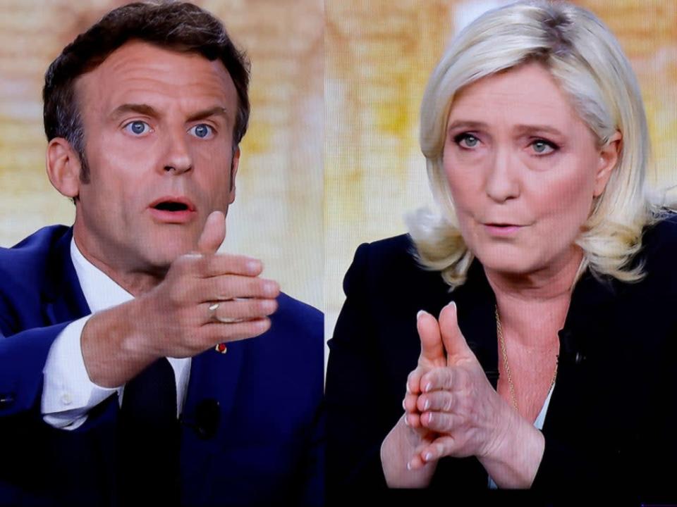 Emmanuel Macron and Marine Le Pen debate each other on 24 April 2022 in Paris, France (LUDOVIC MARIN/AFP via Getty Images)