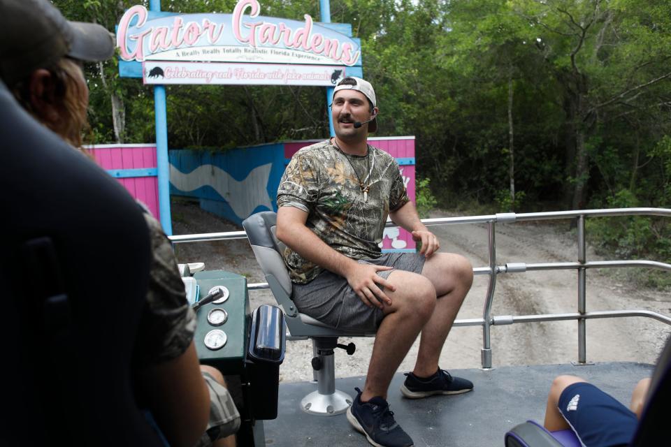 Henry Guetersloh, leads the swap buggy tour on June 25, 2024 for Gatorland visitors, a family-run amusement park celebrating its 75th anniversary in Orlando, Florida.