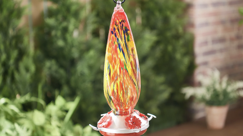 Bring the hummingbirds to your porch with this blown glass feeder.