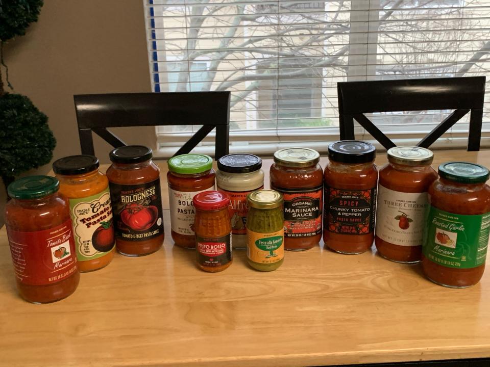 11 sauces from Trader Joe's lined up on a table