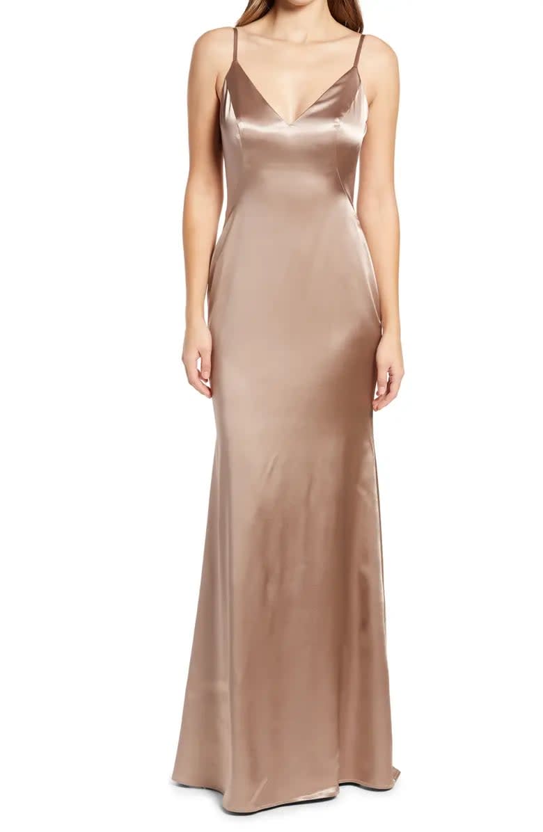 <p>Give this big milestone a Midas touch with metallic bridesmaid dresses. This <span>La Femme Stretch Satin Trumpet Gown</span> ($378) will shine amongst the crowd, but won't upstage the loved-up couple.</p>