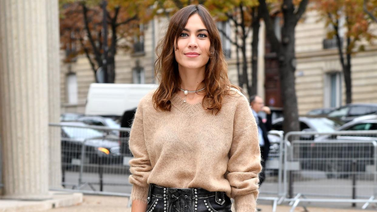 alexa chung in heels and tights and knitwear