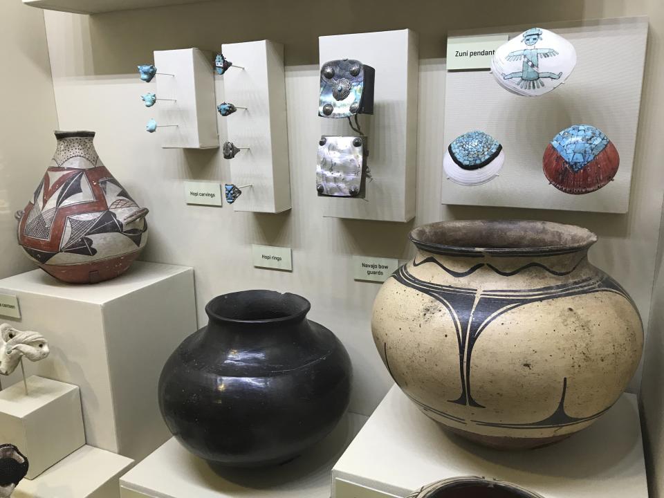 This May 5, 2018 image shows some of the pottery and other items crafted by Southwest tribes that are part of a display inside the visitor center at Mesa Verde National Park near Cortez, Colorado. The White House announced Wednesday, Oct. 2, 2019, that Finland has agreed to return Native American ancestral remains and funerary objects that where excavated in 1891 from Mesa Verde and ended up in the collection of the National Museum of Finland. (AP Photo/Susan Montoya Bryan)