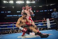 May 7, 2016; Las Vegas, NV, USA; Canelo Alvarez (red shorts) knocks out Amir Khan (maroon shorts) during their middleweight boxing title fight at T-Mobile Arena. Mandatory Credit: Joshua Dahl-USA TODAY Sports