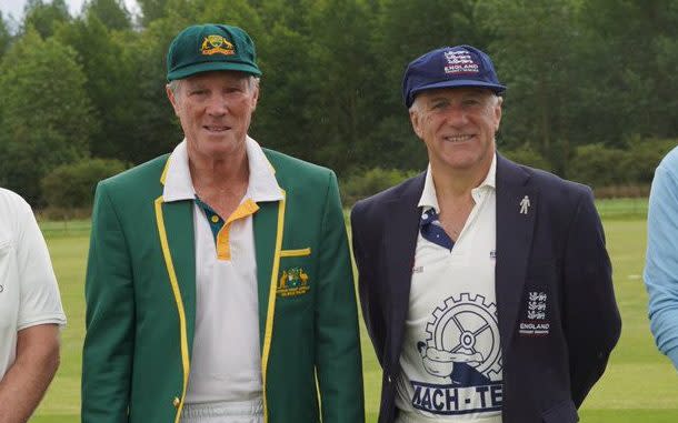 Australia over-60 and England over-60 captains stand for a photo in blazers and whites