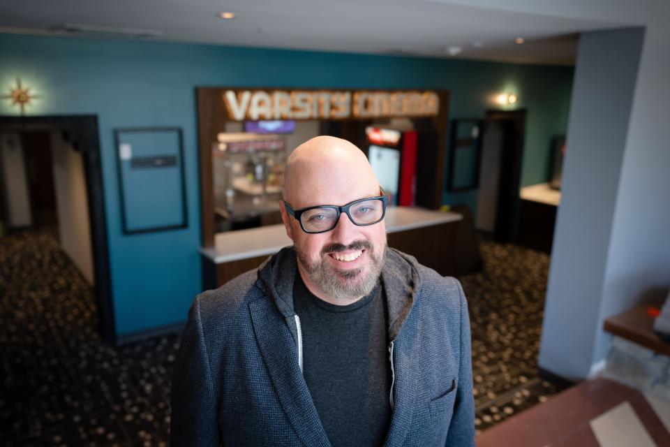 Ben Godar, director of the Des Moines Film Society, gets ready to reveal the renovations to the historic Varsity Cinema.