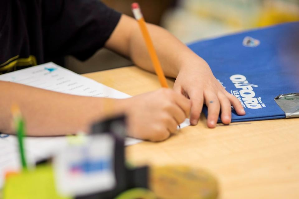 A student works at an Oxford Learning program in Toronto on Thursday, Dec. 7, 2017. 