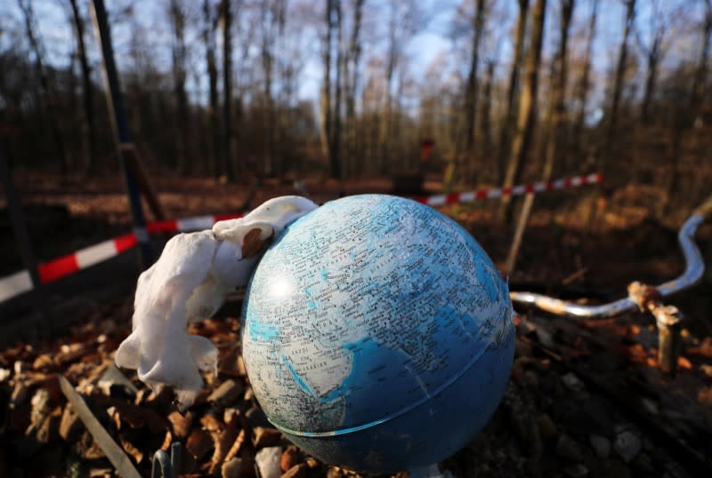 A Molotov cocktail is prepared in a globe in the Hambach Forest