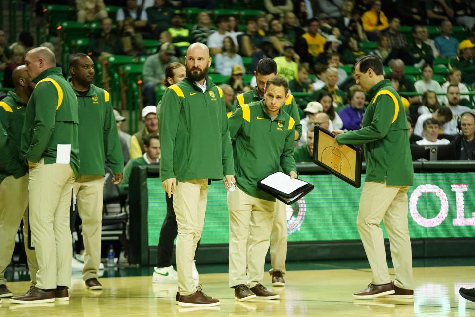 Baylor assistant coach John Jakus and the rest of the Bears coaching staff.