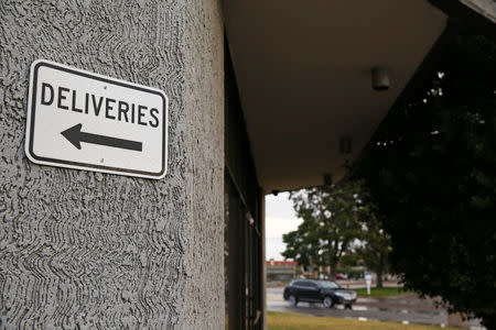 A sign points to the delivery entrance at Biological Resource Center, one of several human body donation companies that was under investigation by the FBI, in Phoenix, Arizona, U.S. December 17, 2017. REUTERS/Caitlin O'Hara