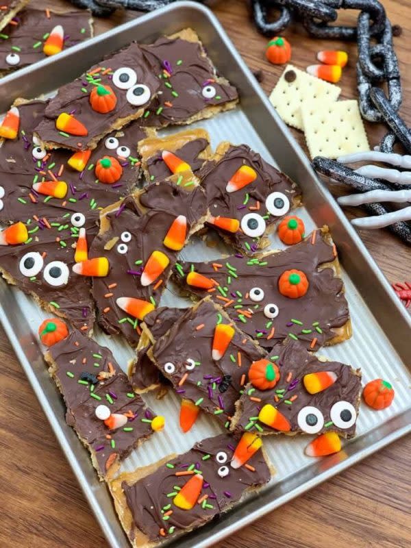 <p>Back to My Southern Roots</p><p>Halloween-themed chocolate bark is an adorable treat to make with your kids and bring to your next Halloween party.</p><p><strong>Get the recipe: <a href="https://www.backtomysouthernroots.com/halloween-chocolate-crack/" rel="nofollow noopener" target="_blank" data-ylk="slk:Halloween Chocolate Crack;elm:context_link;itc:0;sec:content-canvas" class="link ">Halloween Chocolate Crack</a></strong></p>