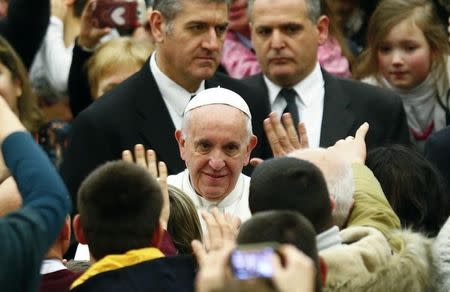 Pope Francis leaves at the end of a special audience for the Jubilee of the workers of the shrines in Paul VI hall at the Vatican, January 21, 2016. REUTERS/Tony Gentile